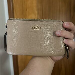 Tan coach wristlet